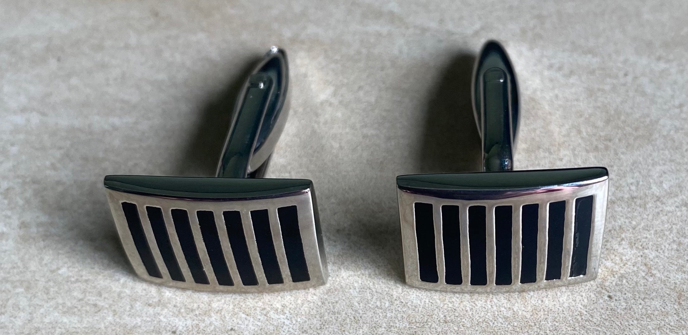 Striped black and silver curved rectangular cufflinks